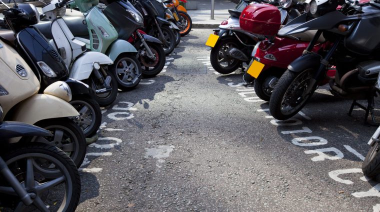 Motor bikes parked in a row Motor bikes parked in a row